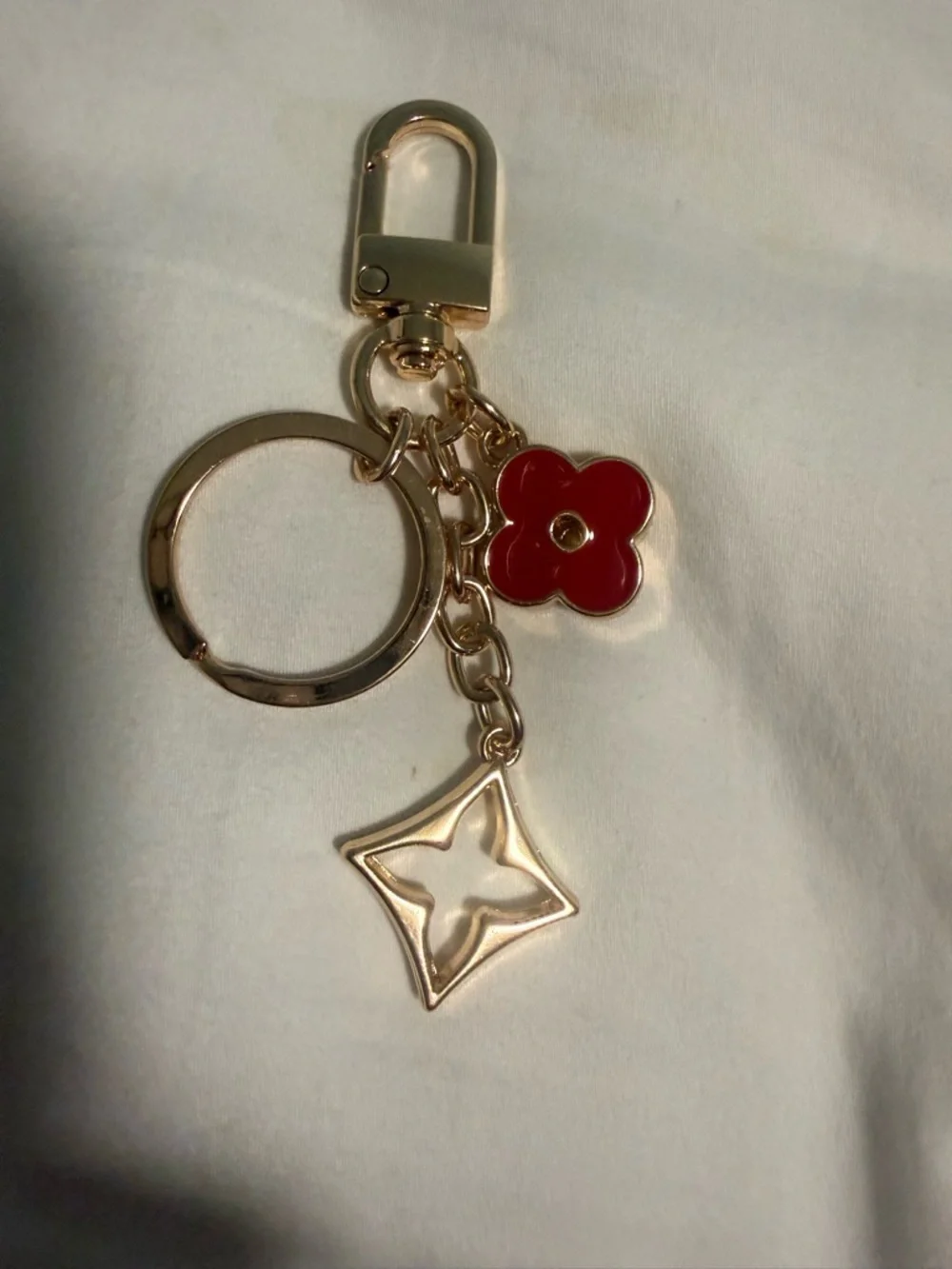 KeyChain with a hook for Bags with Red Flower Charm and gold tone accents!